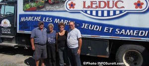 les Freres Leduc et leur conjointe devant un de leurs camions Photo INFOSuroit